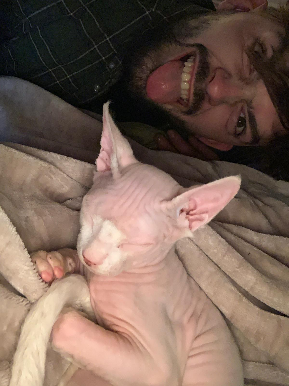 Joshua Bragg pictured with Peppa the cat