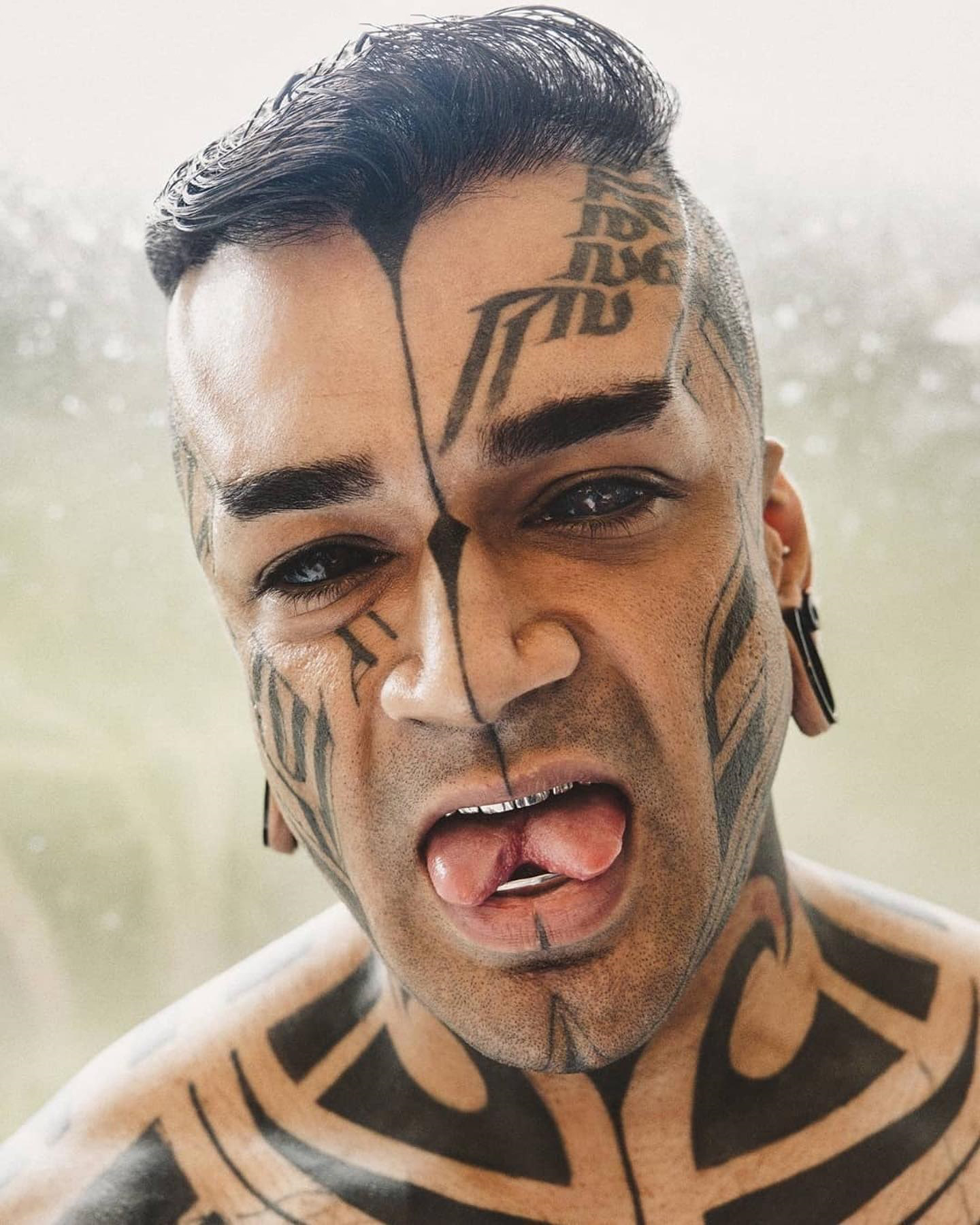 Karan reveals his split tongue and body tattoos