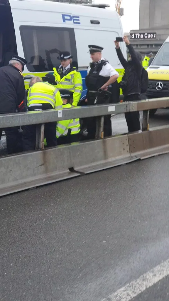 Cops arresting Stop Oil protestors