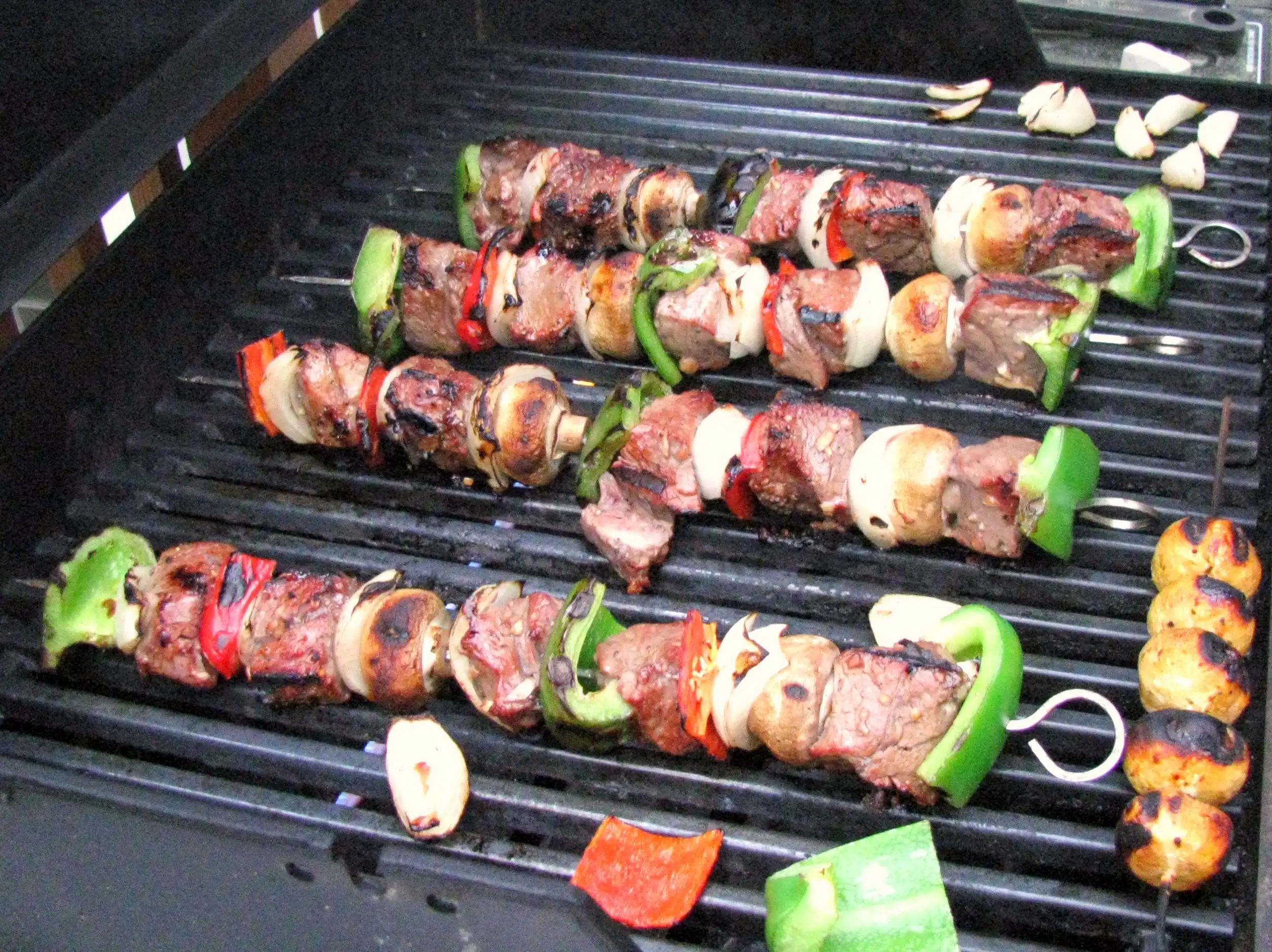 Kebabs on a grill.