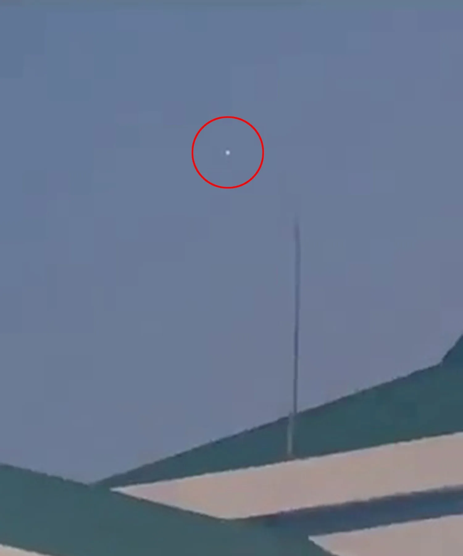 Video grab - the UFO hovering above Bir Tikendrajit International Airport.