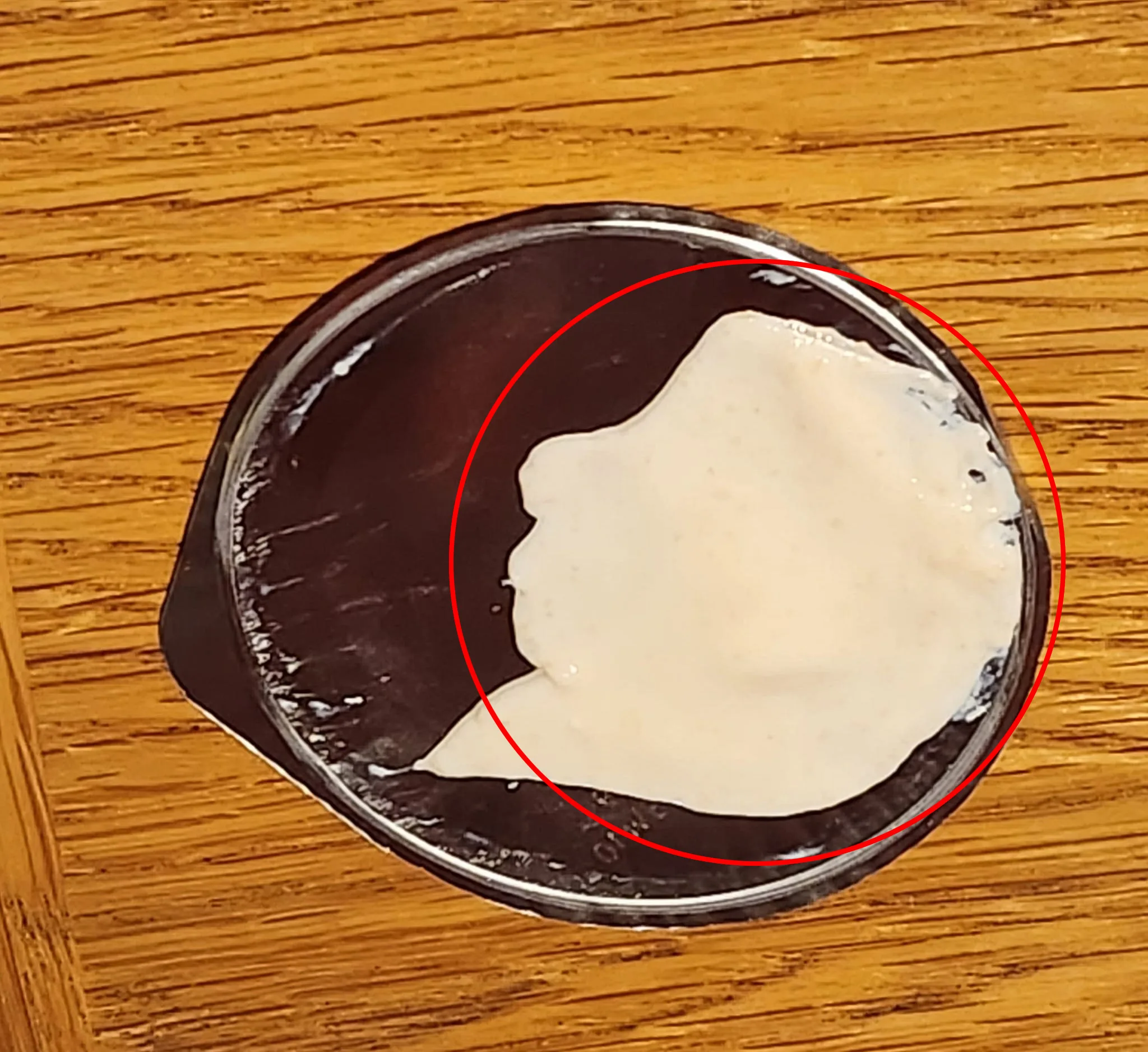 The yoghurt pot lid featuring the pattern that bears an uncanny resemblance to Alfred Hitchcock, leaves social media users shocked.