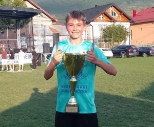 the 13-year-old boy collapses and dies on football pitch after reportedly consuming three energy drinks. Outrage follows as Romanian Parliament approves bill banning sale of such drinks to minors.