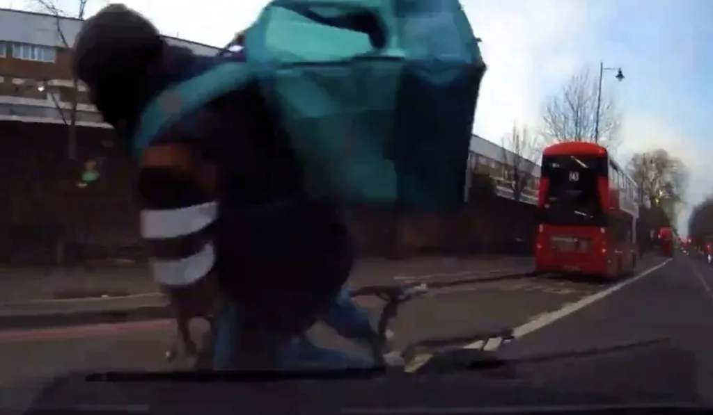 VIDEO: Food delivery rider on WRONG side of the road gets knocked off ...