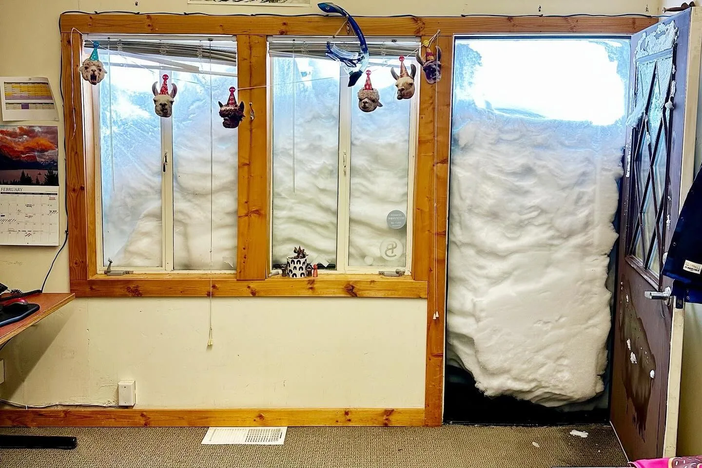 A worker at Sugar Bowl Resort in Norden, near Sacramento, California, encountered a wall of snow on the second floor after a two-foot overnight storm.