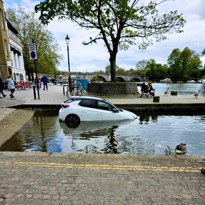 VIDEO: What-er idiot! Hapless driver’s car ends up underwater after parking it on river slipway…but at least the windscreen wipers are working