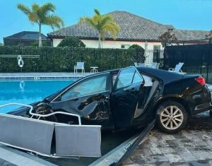 Car ends up in community swimming pool after roundabout crash | Need To ...