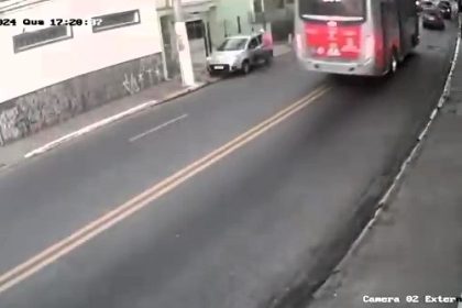 Lucky driver escapes seconds before bus crushes his car in São Paulo. Bus driver reportedly lost control due to sudden illness. No injuries reported.