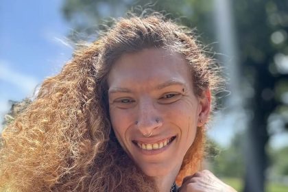 A woman arrested after a crash revealed a dead body in her car. Margot Lewis, 32, faces charges for interfering with a dead body. The victim, Liara Tsai, died from violent injuries.