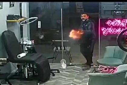 A tattoo artist disarmed a shotgun-wielding rival in a dramatic confrontation over a stolen customer. The incident, captured on CCTV, left two injured and the suspect in custody.