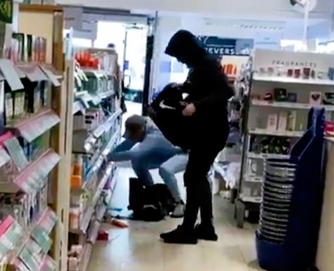 An angry customer confronts a shoplifter at a Boots store in affluent Woodside Park, NW London, highlighting a surge in shoplifting as theft hits a 20-year high.