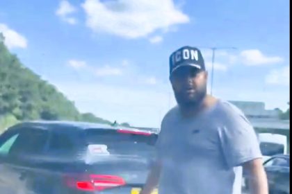 A man threatened to smash a driver’s face during a road rage incident on the M25 near Heathrow. Caught on video, the altercation involved an untaxed black Audi estate.