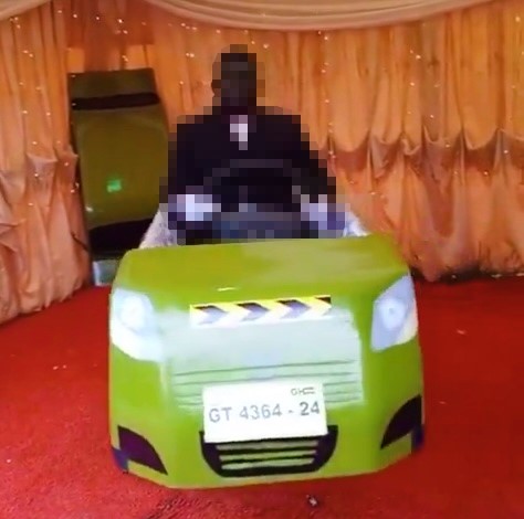 A deceased cabbie in Ghana was buried upright in a taxi-shaped coffin with his hands on the steering wheel. The unique funeral featured the coffin spinning on a stand.