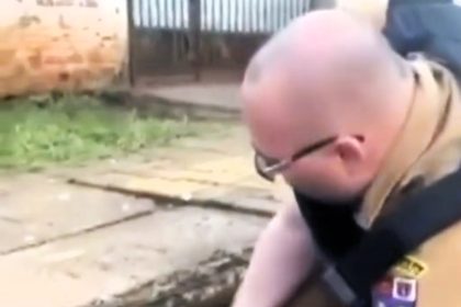 Heartwarming video captures a Brazilian policeman rescuing a trapped dog from a storm drain in Foz do Iguaçu. The pooch emerged unharmed, and the officer was relieved.