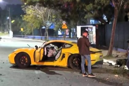 A Porsche driver in São Paulo faces homicide charges after allegedly ramming a biker who broke his wing mirror, resulting in the biker's death. The victim leaves behind a wife and young son.