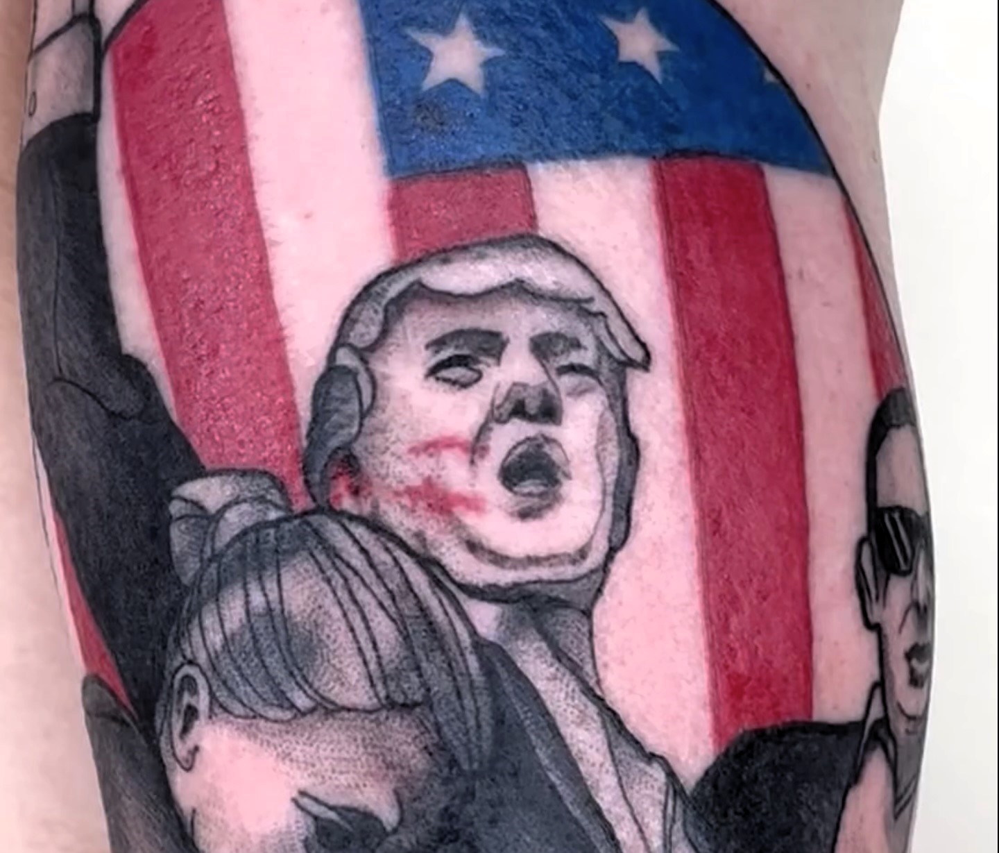 A Trump supporter gets a $700 tattoo capturing the former president's defiant gesture post-assassination attempt. Tattoo goes viral, sparking both praise and criticism online.