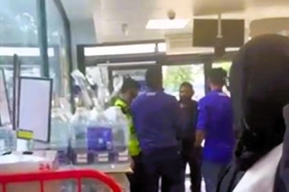 A would-be shoplifter spat at a Tesco worker after being stopped from stealing at a Tesco Express near Wembley Stadium, London. The incident, captured on video, shocked onlookers.