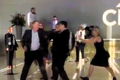 A climate activist was hospitalized after an alleged altercation with a Citibank security guard during a protest against the bank's fossil fuel funding. Citibank denies wrongdoing.