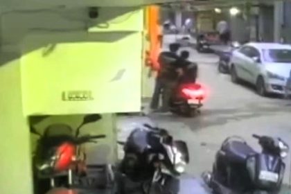 Horrifying footage shows a teenage boy struck by a falling air-conditioning unit in Delhi, resulting in his tragic death. Police are investigating the shocking incident.