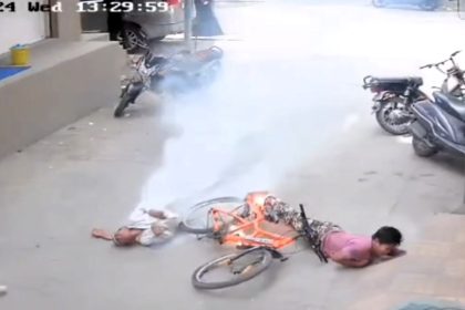 Shocking footage captures the moment two students in India were electrocuted on their way to school, leaving one dead and the other critically injured. Investigation underway.