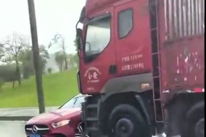 Terrifying moment as a truck pushes a Mercedes sideways for half a mile on a busy motorway in China during heavy rain. Miraculously, the driver escaped without serious injury.