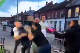 Seven men brawl outside a South London restaurant, with chairs flying and trainers lost, in a wild street fight caught on camera. Police are investigating the shocking incident.