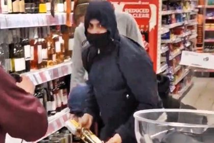 Masked thieves casually ransack Sainsbury’s wine fridge, leaving staff and shoppers stunned; £200 worth of items stolen as police investigate the brazen theft.