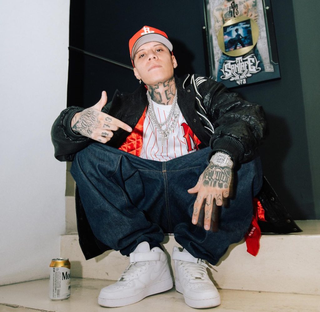 Rapper Santa Fe Klan’s tour bus crashes into a house after handbrake failure on steep hill—fans and rapper escape unscathed. Concert goes on despite the close call!