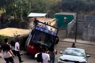 Rapper Santa Fe Klan’s tour bus crashes into a house after handbrake failure on steep hill—fans and rapper escape unscathed. Concert goes on despite the close call!