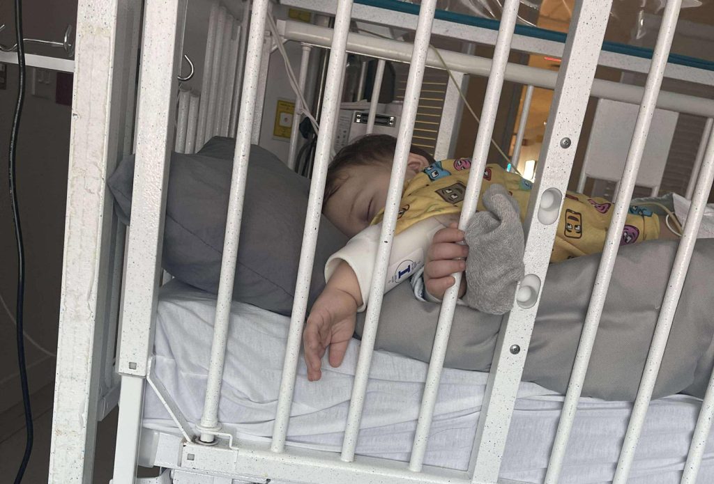 Toddler survives life-threatening injury after swallowing button battery, leaving parents urging others to avoid battery-powered toys to prevent similar accidents.