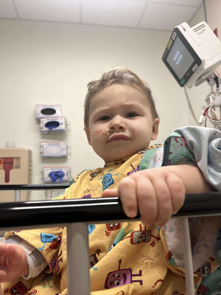 Toddler survives life-threatening injury after swallowing button battery, leaving parents urging others to avoid battery-powered toys to prevent similar accidents.