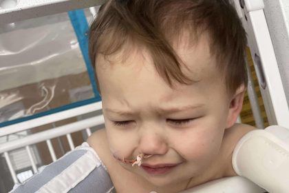 Toddler survives life-threatening injury after swallowing button battery, leaving parents urging others to avoid battery-powered toys to prevent similar accidents.