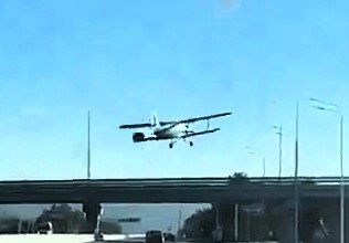 Terrifying moment as plane with nine on board crash-lands near Russian motorway; four injured but no casualties in miraculous escape. Investigation underway.