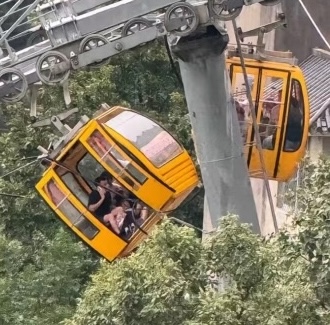 A tourist fell 30ft from a cable car in China after strong winds caused the doors to open. She survived with non-life-threatening injuries. An investigation is ongoing.