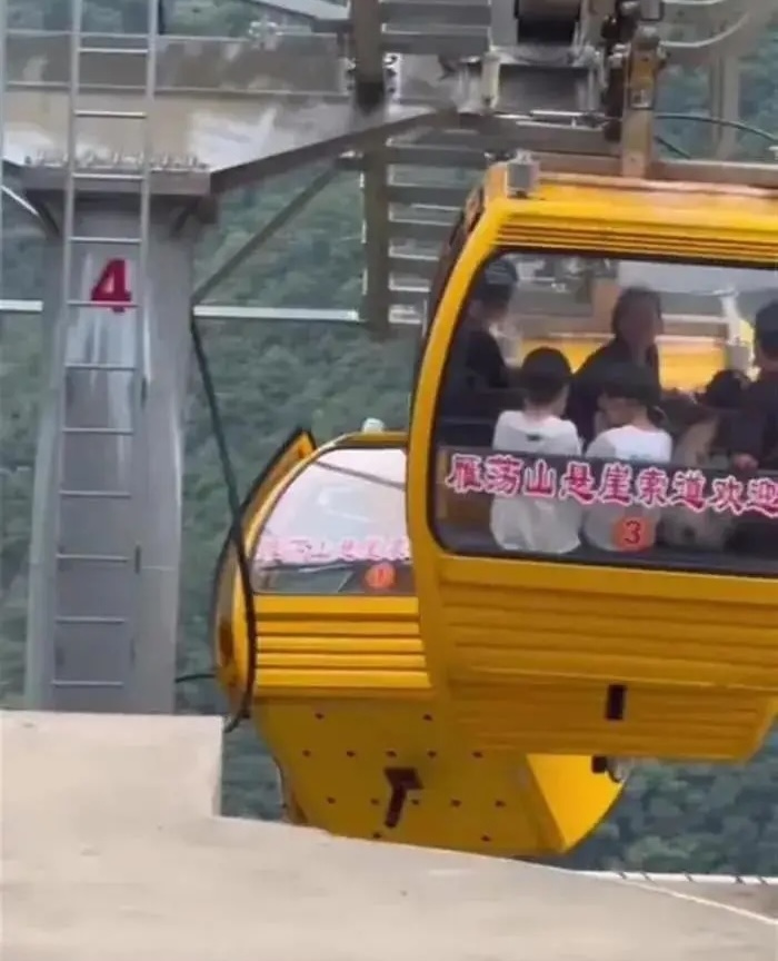 A tourist fell 30ft from a cable car in China after strong winds caused the doors to open. She survived with non-life-threatening injuries. An investigation is ongoing.