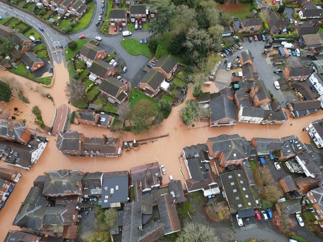 Drone footage reveals Storm Bert’s devastation in Tenby, Wales, with floodwaters submerging streets, homes, and cars. Alerts remain as heavy rain batters the UK.