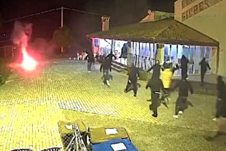 Italian football ultras launch smoke bomb and metal bar attack on a recreational centre, leaving one man hospitalized with severe head injuries. Local authorities vow increased security.