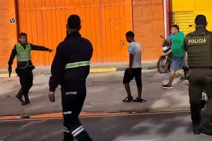 A cop shot a knife-wielding thug during a violent clash with four brothers in Colombia, leaving three officers injured. The suspects face assault charges as investigations continue.