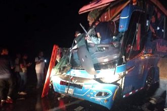 Over 20 passengers were injured when two buses collided on a wet road in western Colombia, with harsh weather and speed bumps cited as possible factors. An investigation is underway.