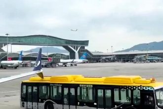 A shuttle bus crashes into a Shandong Airlines Boeing 737 at Hong Kong Airport, delaying the flight by seven hours. No injuries reported as repairs are completed.