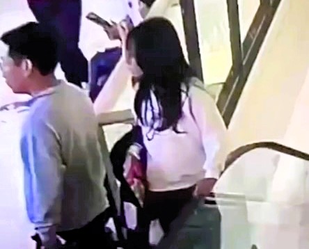 A woman tragically fell to her death at a shopping centre in Jining City, China, after losing balance on an escalator, sparking concerns over safety measures.