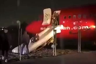 Norwegian Boeing 737 overshoots icy runway in Molde, halting 50 feet from the sea. Passengers evacuated safely via slides; weather and runway conditions under investigation.