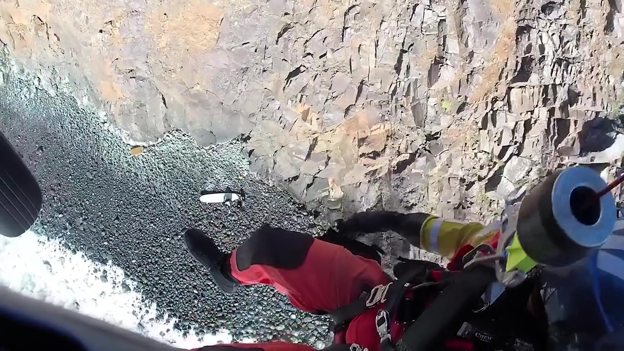 A dad and son were rescued by helicopter after getting stranded on a rock while boogie boarding at Indian Beach, Oregon, prompting warnings about the dangers of sneaker waves.