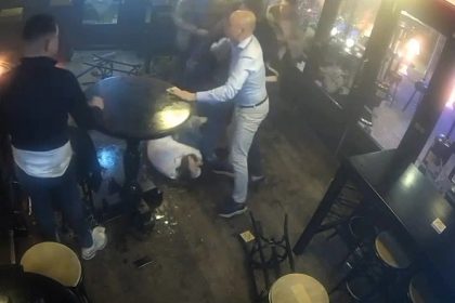 A bar brawl in Helmond, Netherlands, captured on CCTV, saw violent punches, chair attacks, and a woman kicked in the head. Three men were arrested but remain suspects.