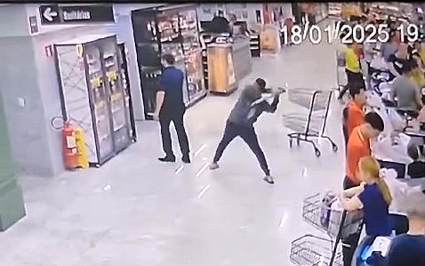 A Brazilian man, enraged by his wife's work complaints, attacked her manager with a shovel in a supermarket, leaving the victim hospitalized but saved by his phone, which absorbed much of the blow.