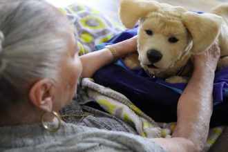 A robotic Labrador, Jennie, designed by Tombot, offers lifelike companionship for dementia patients. This AI pet provides comfort without the need for feeding or walking.