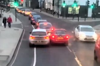 Dash cam captures stubborn BMW driver refusing to yield to a Nissan Micra in a road rage clash near Ealing, London, sparking debate over right of way and patience