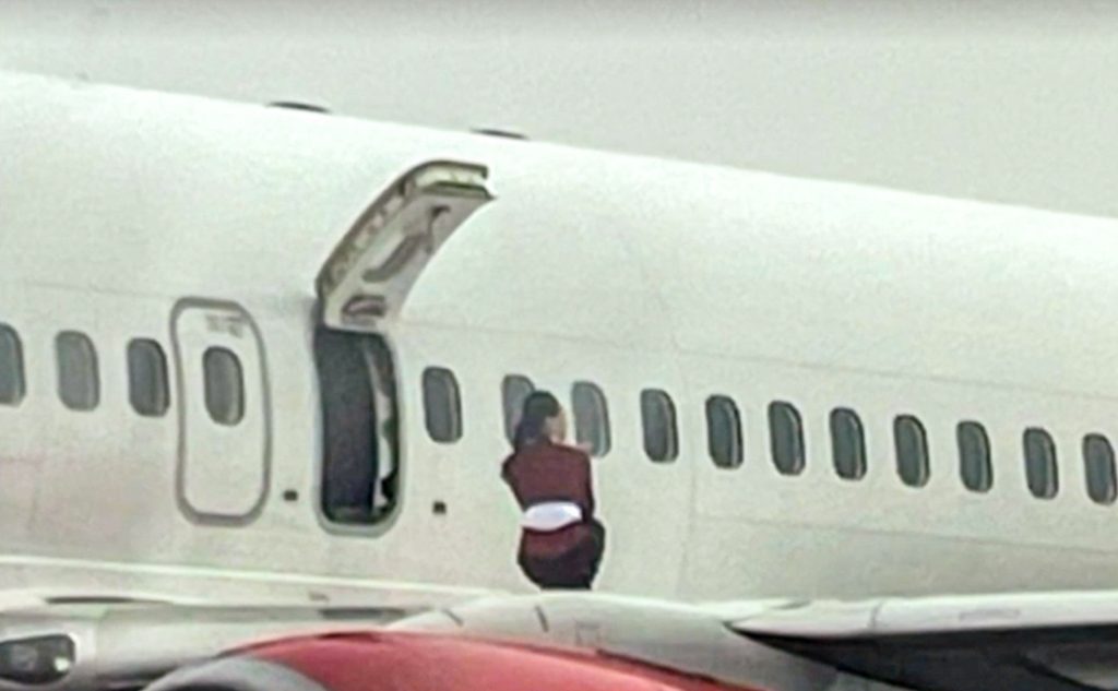 Airline investigates stewardesses who opened emergency exit and posed on plane wing during snow delay at South Korea’s Cheongju Airport, sparking security concerns.