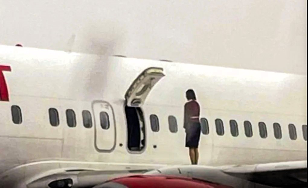 Airline investigates stewardesses who opened emergency exit and posed on plane wing during snow delay at South Korea’s Cheongju Airport, sparking security concerns.