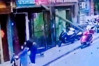 A man in China was critically injured after a falling utility pole struck him in front of his family. He remains in a coma as authorities investigate the incident.